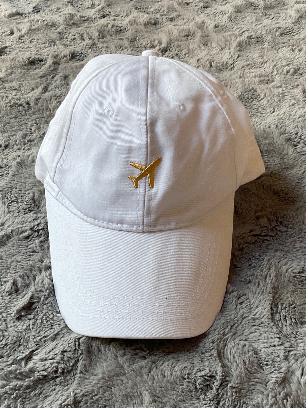 White Baseball Cap with Gold Airplane Embroidery